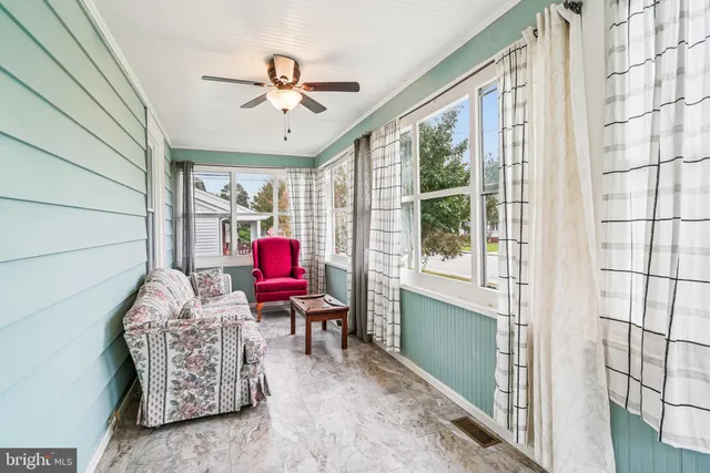 a living room with furniture and a window