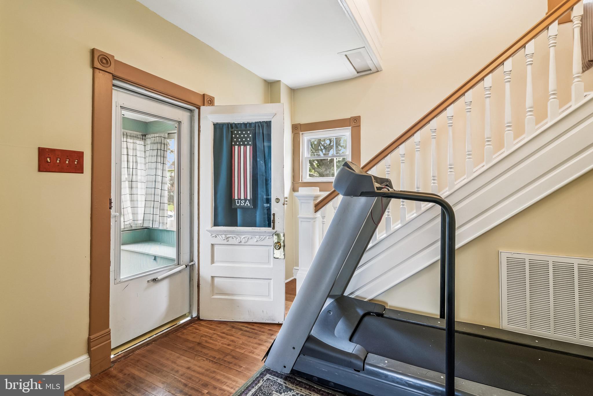 16 Columbia Avenue Crisfield, MD 21817 - Photo 6 of 36 a view of an entryway with wooden floor and stairs