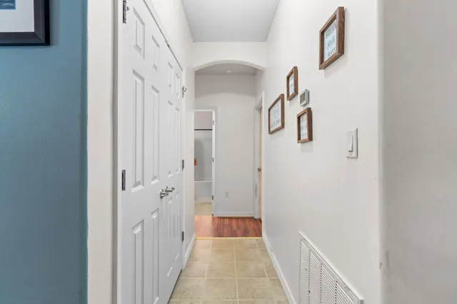a view of a hallway with white walls