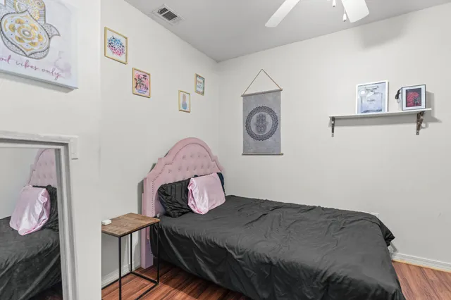 a bedroom with a bed and a table in it