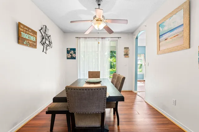 a view of a dining room with furniture window and wooden floor