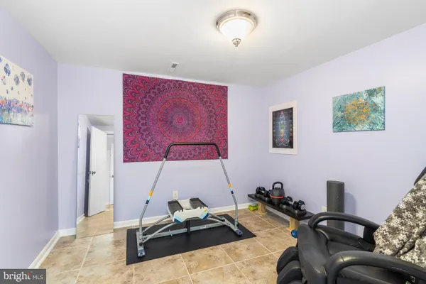 a room with furniture and air hockey table