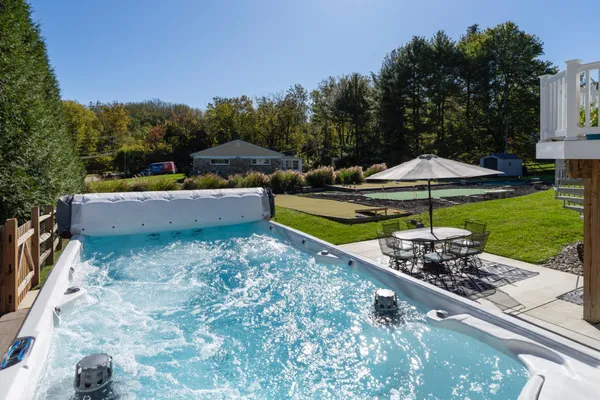 a view of a backyard with a patio and outdoor seating