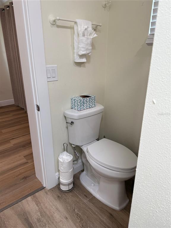 4634 McIntosh Road Sarasota, FL 34233 - Photo 11 of 20 a bathroom with a toilet and a mirror