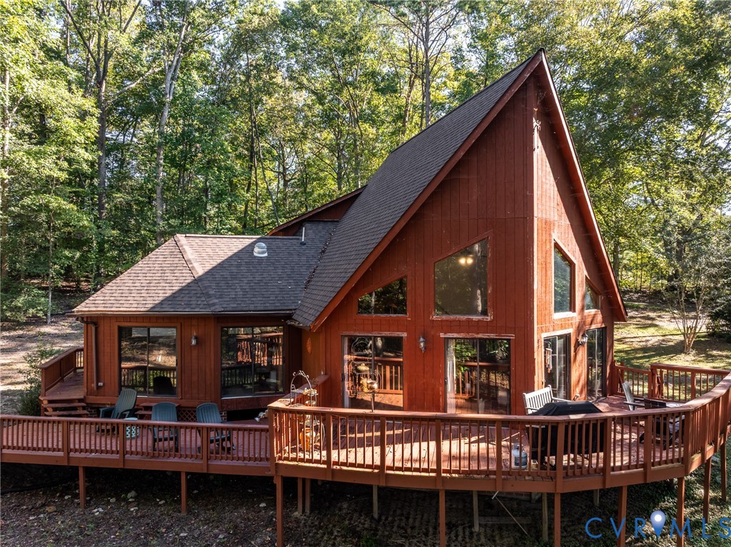 7399 Club Drive Quinton, VA 23141 - Photo 1 of 42 a view of a house with a deck and furniture