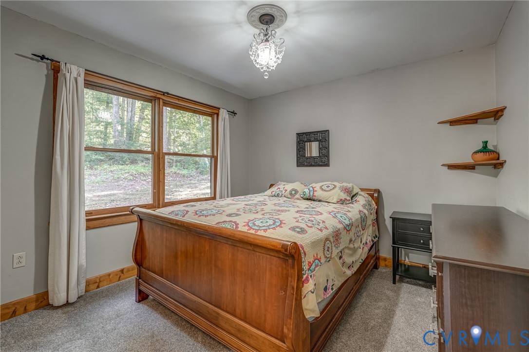 7399 Club Drive Quinton, VA 23141 - Photo 19 of 42 a bedroom with a bed and a window