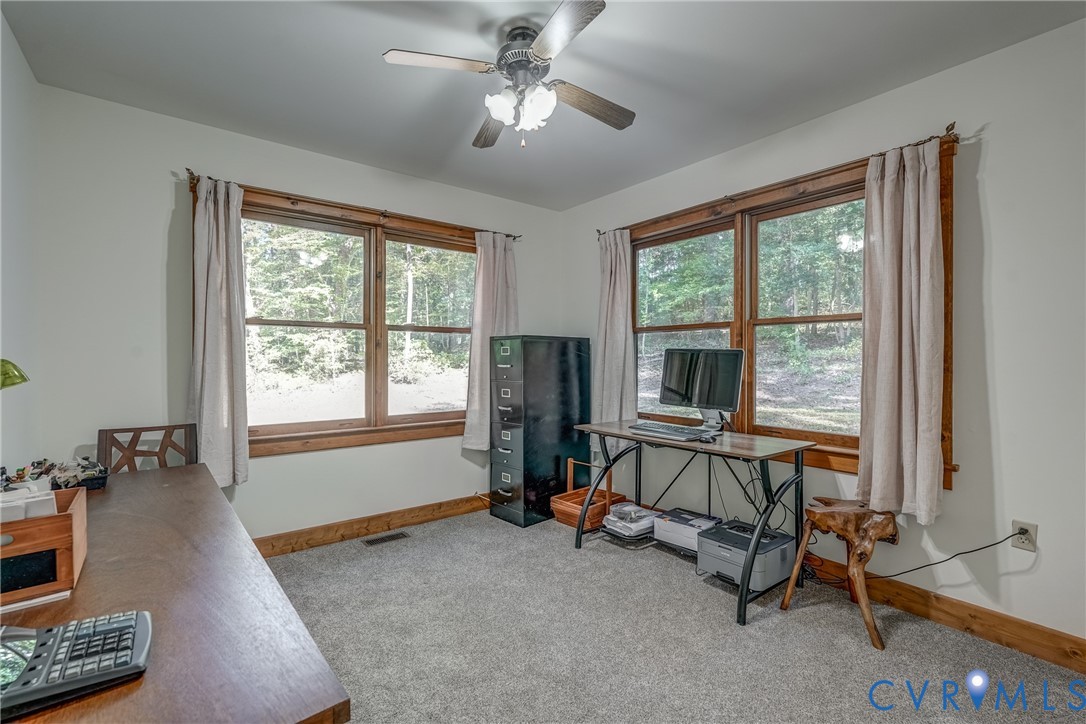 7399 Club Drive Quinton, VA 23141 - Photo 20 of 42 a view of a livingroom with workspace and a window