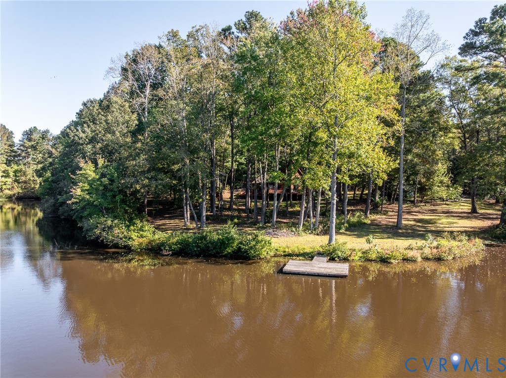 7399 Club Drive Quinton, VA 23141 - Photo 39 of 42 a view of a lake view with houses a lake and trees
