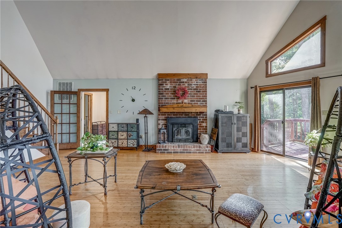 7399 Club Drive Quinton, VA 23141 - Photo 7 of 42 a living room with fireplace furniture and a large window