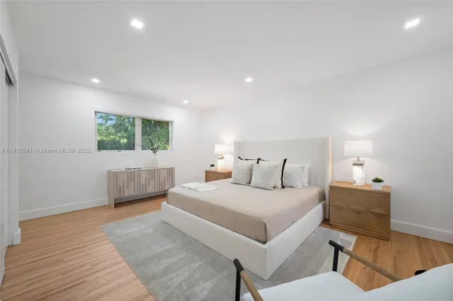 a bedroom with a bed and a couch