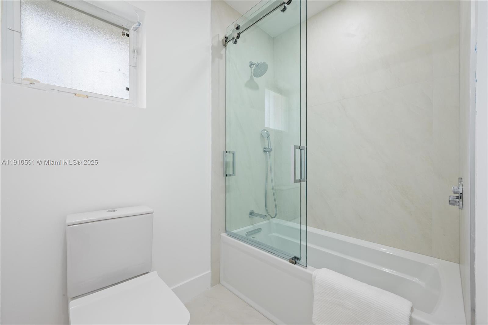 5211 Granada Boulevard Coral Gables, FL 33146 - Photo 18 of 25 a bathroom with a shower and toilet