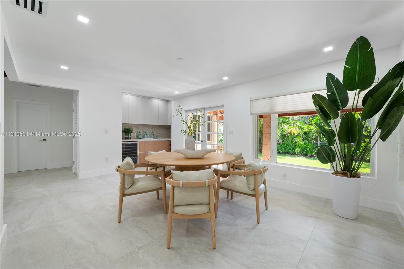 5211 Granada Boulevard Coral Gables, FL 33146 - Photo 10 of 25 a view of a dining room with furniture window and outside view