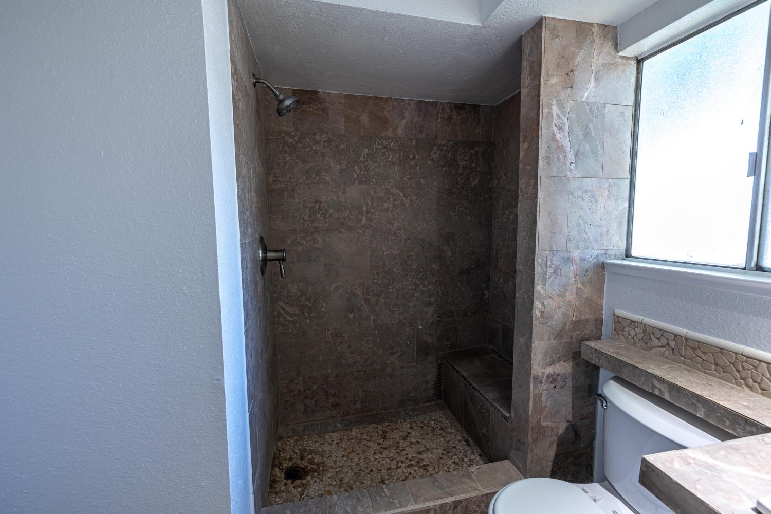 3700 Tully Road, Unit 5 Modesto, CA 95356 - Photo 18 of 38 a bathroom with a shower and a toilet