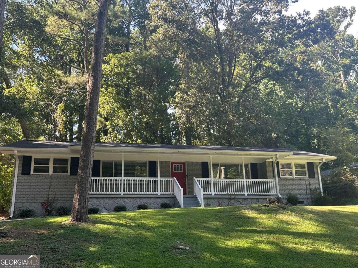 3207 Cloverhurst Drive East Point, GA 30344 - Photo 1 of 1 a view of a house with a yard