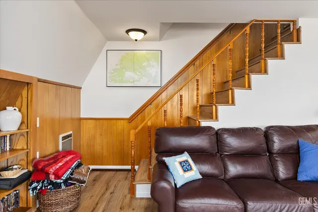 a view of workspace with wooden floor and stairs