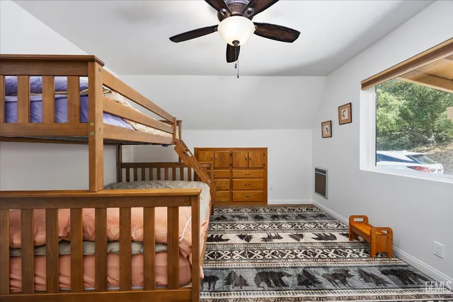 a bedroom with furniture and window