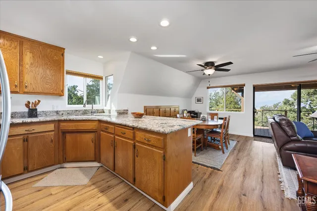 a open kitchen with stainless steel appliances granite countertop a stove and cabinets