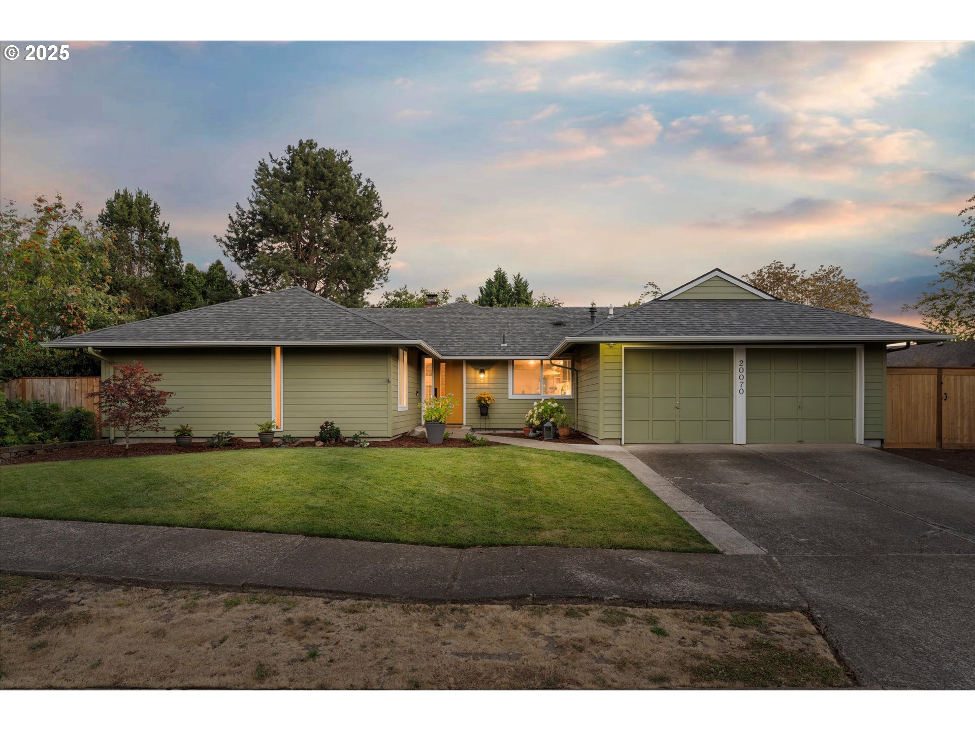 20070 Southwest Imperial Street Beaverton, OR 97003 - Photo 1 of 48 a view of a yard with a house in the background