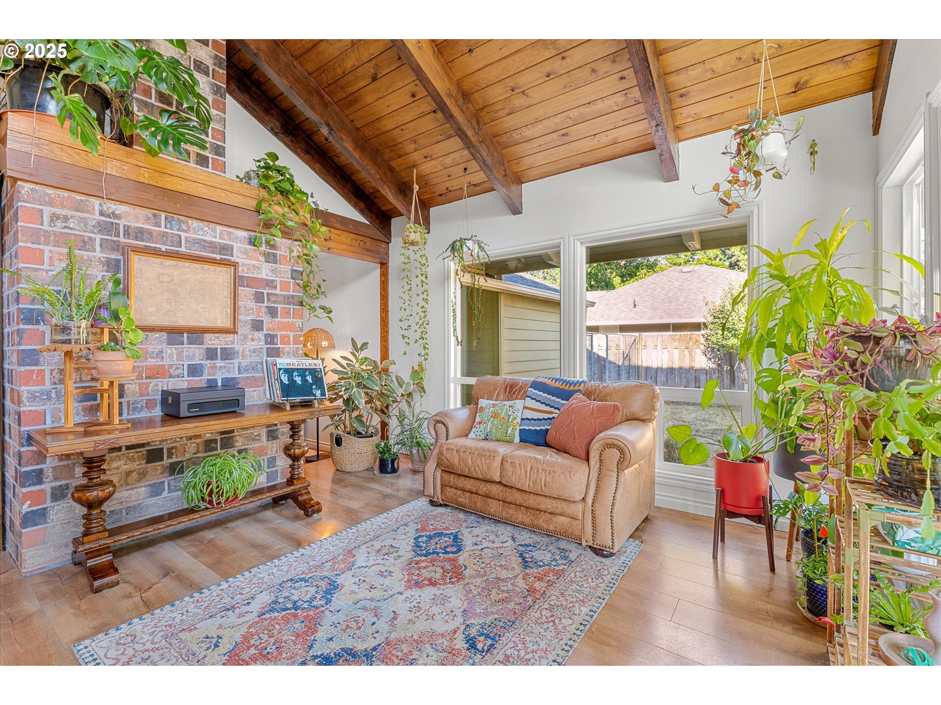 20070 Southwest Imperial Street Beaverton, OR 97003 - Photo 16 of 48 a living room with patio furniture and a potted plant