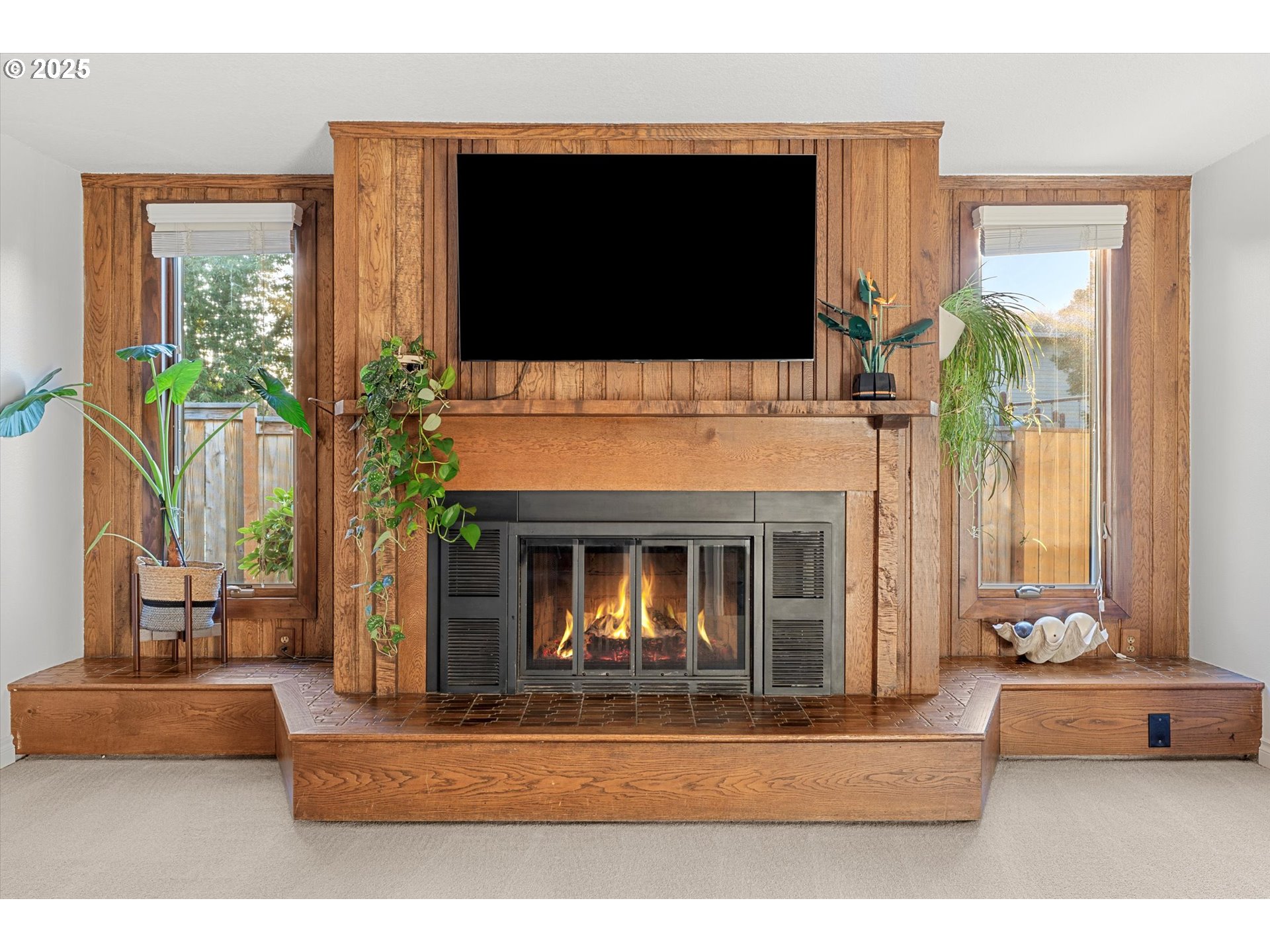 20070 Southwest Imperial Street Beaverton, OR 97003 - Photo 25 of 48 a living room with furniture fireplace and flat screen tv