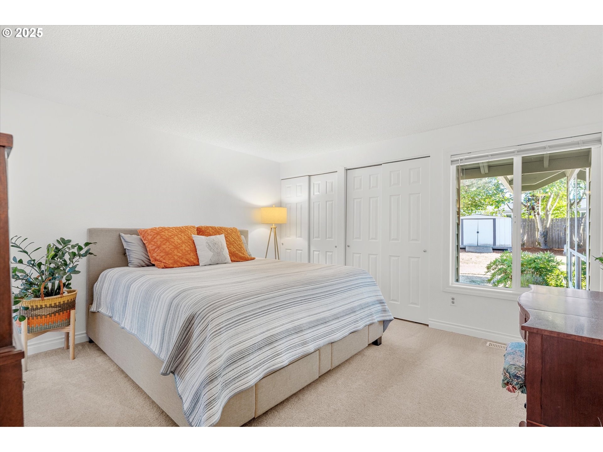20070 Southwest Imperial Street Beaverton, OR 97003 - Photo 27 of 48 a spacious bedroom with a bed and a window