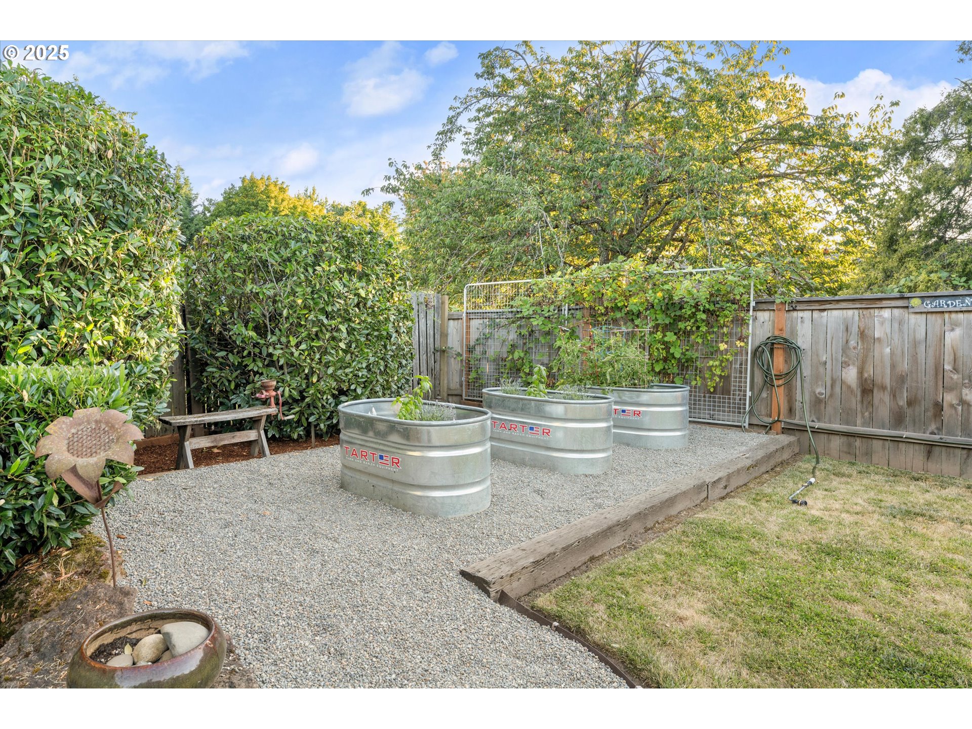 20070 Southwest Imperial Street Beaverton, OR 97003 - Photo 40 of 48 a backyard of a house with table and chairs