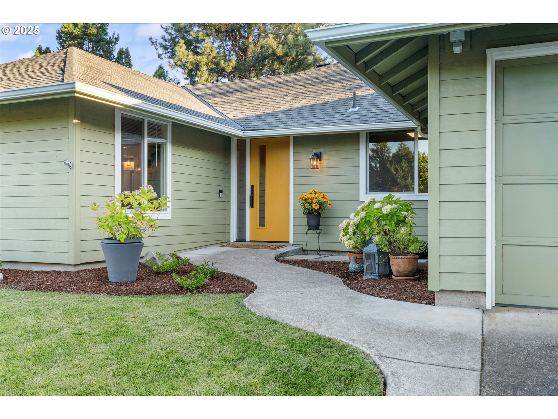 20070 Southwest Imperial Street Beaverton, OR 97003 - Photo 5 of 48 a front view of a house with a yard