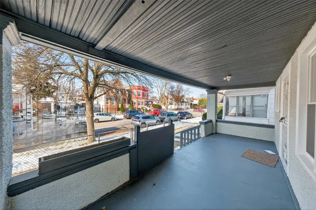 a open kitchen with stainless steel appliances granite countertop a lot of cabinets and a wooden floor