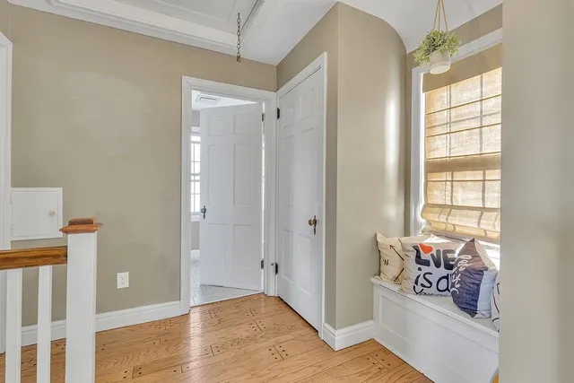 a very nice looking room with wooden floor and a window