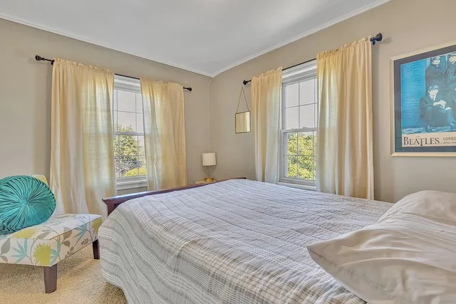 a bedroom with a bed and a cabinet