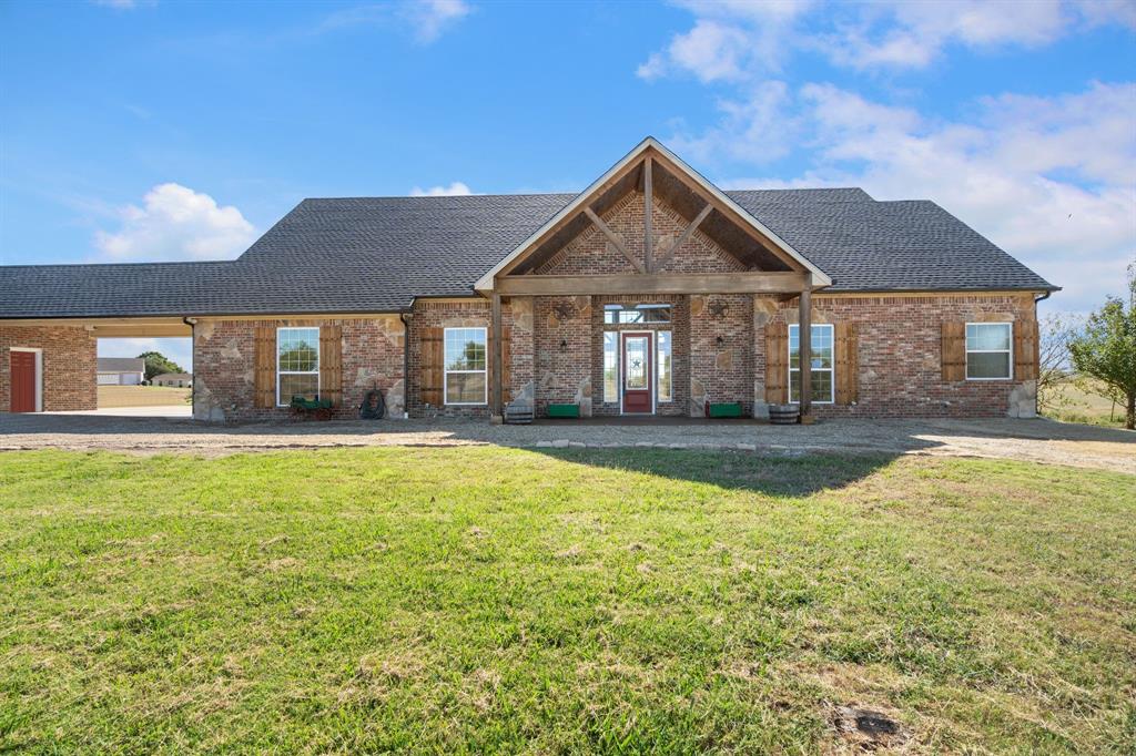 1943 Alsdorf Road Ennis, TX 75119 - Photo 2 of 39 a front view of a house with a yard