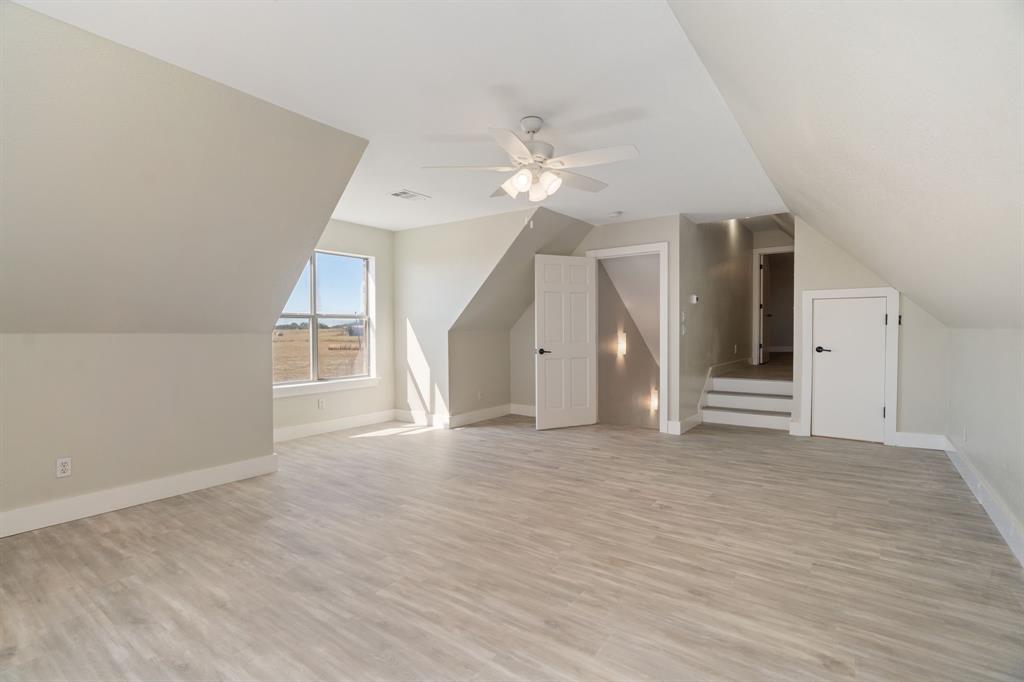 1943 Alsdorf Road Ennis, TX 75119 - Photo 33 of 39 wooden floor in an empty room with a window