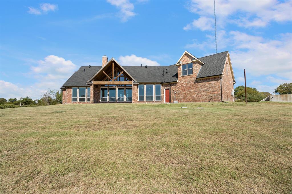 1943 Alsdorf Road Ennis, TX 75119 - Photo 36 of 39 a front view of a house with a yard
