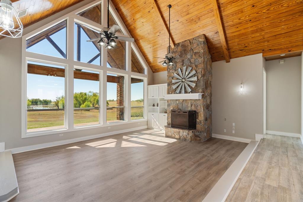1943 Alsdorf Road Ennis, TX 75119 - Photo 8 of 39 a view of an empty room with wooden floor and a window
