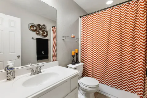 a bathroom with a sink and a toilet