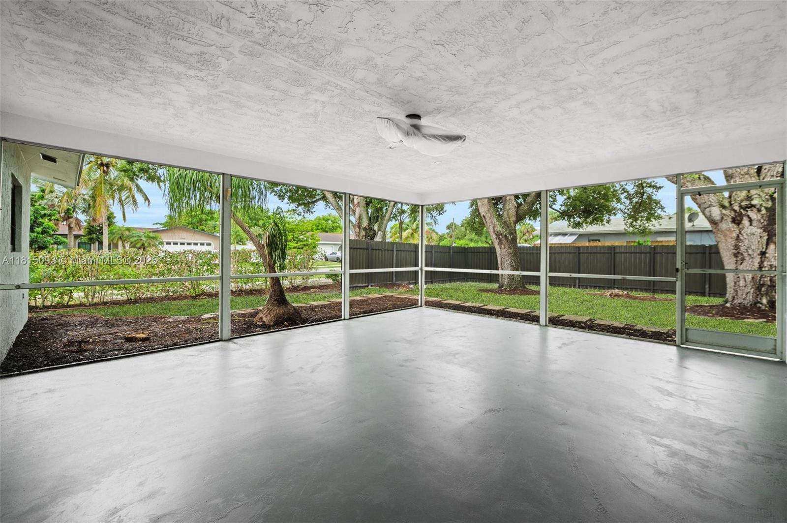 679 Southwest 17th Court Boca Raton, FL 33486 - Photo 17 of 18 a view of a deck with a big yard