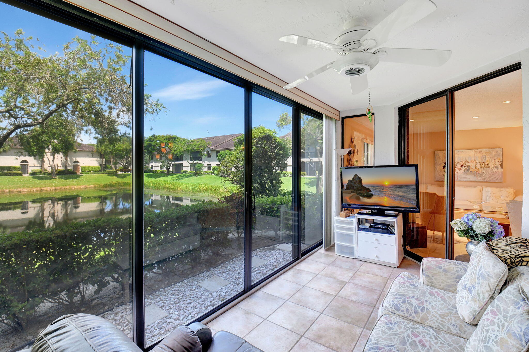 5217 Brisata Circle, Unit E Boynton Beach, FL 33437 - Photo 16 of 56 Glass & Screen Enclosed Lanai