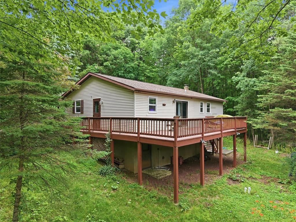 520 Highland Hill Road Jim Thorpe, PA 18235 - Photo 59 of 83 Perched among verdant trees, this secluded residence features an expansive deck for enjoying nature.