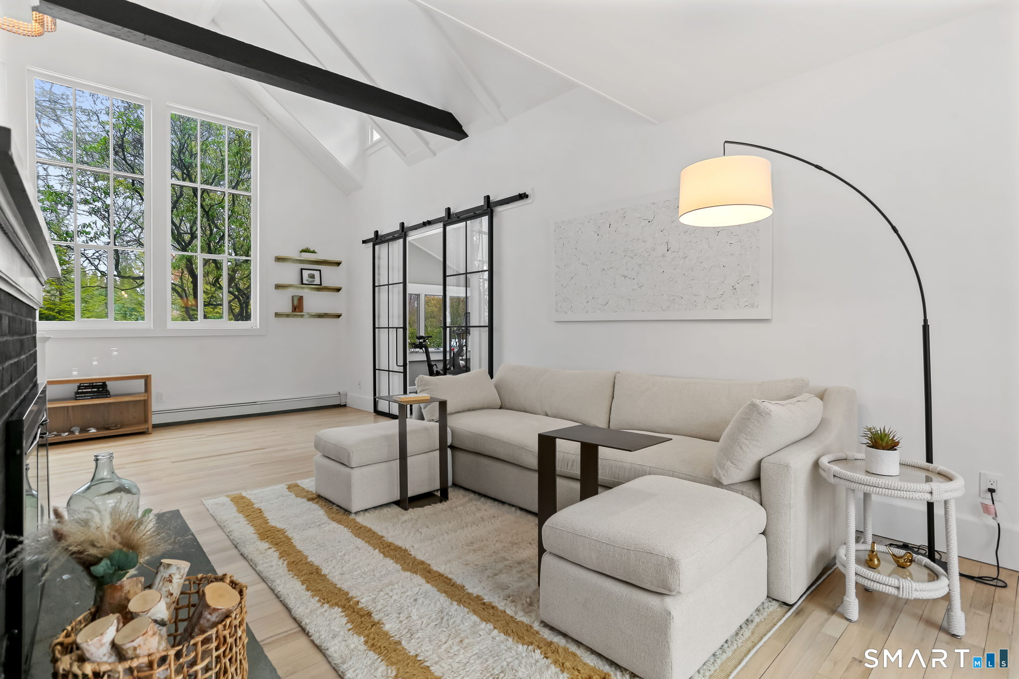 3 Riverview Road Westport, CT 06880 - Photo 1 of 29 a living room with furniture and a floor to ceiling window