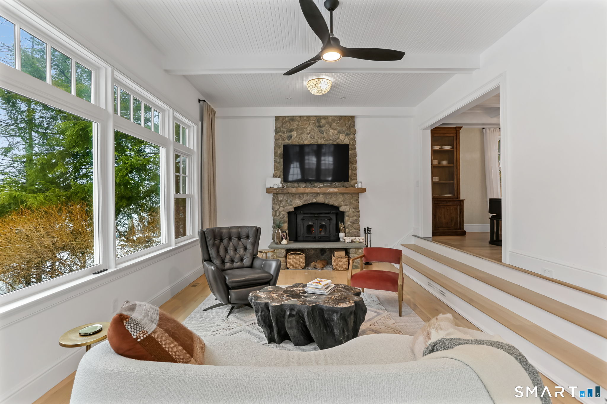 3 Riverview Road Westport, CT 06880 - Photo 11 of 29 a living room with furniture and a fireplace