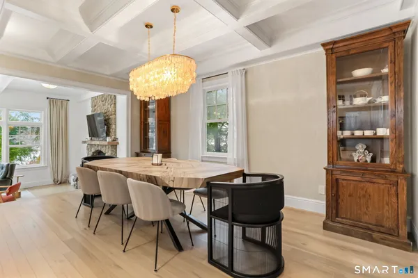 a view of a dining room with furniture window and wooden floor
