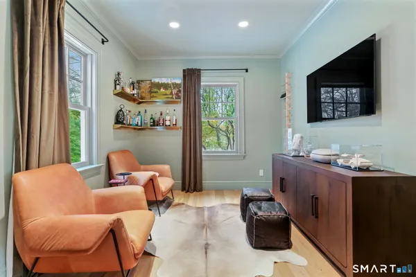 a bedroom with furniture and a window