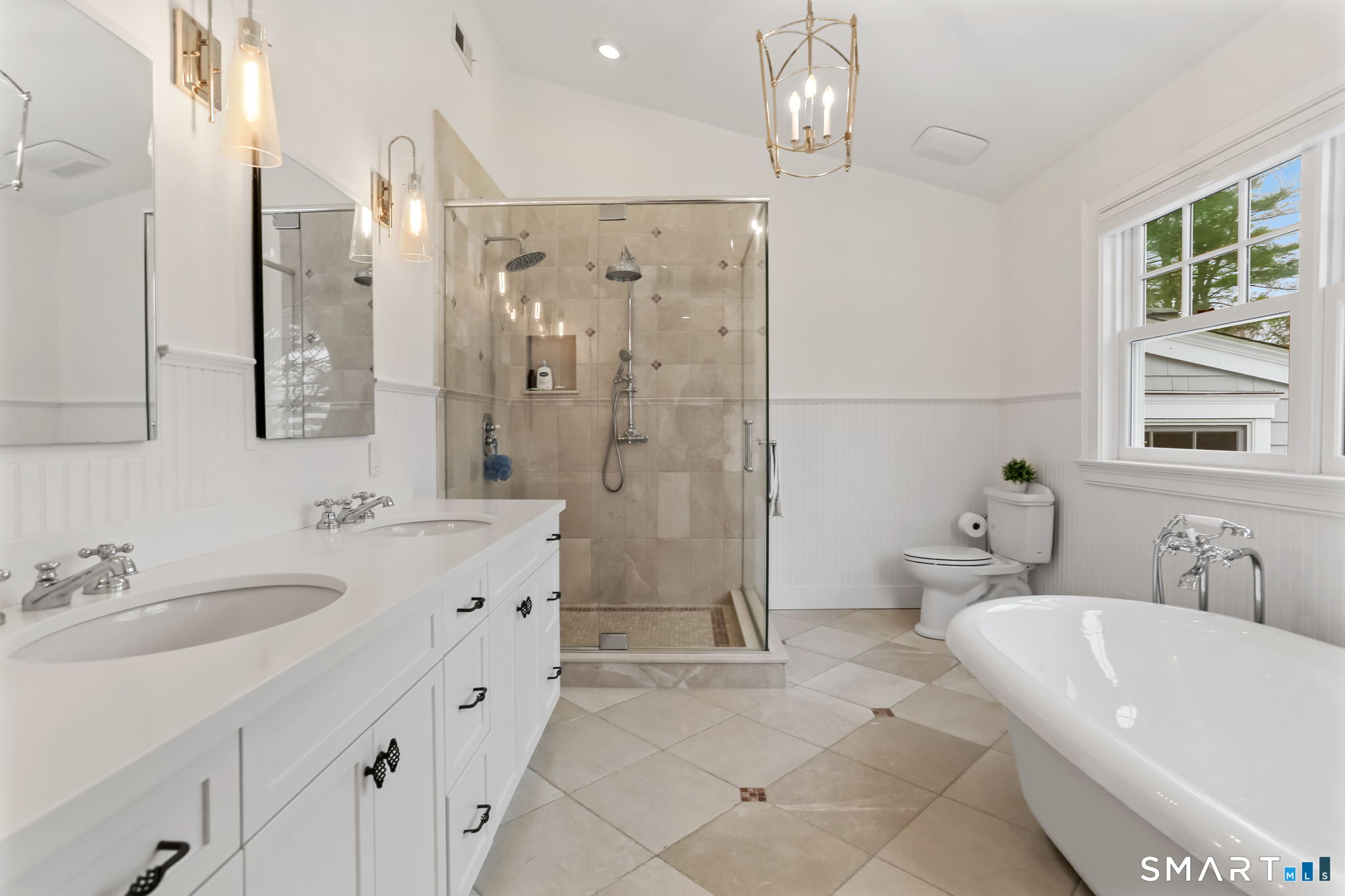 3 Riverview Road Westport, CT 06880 - Photo 17 of 29 a bathroom with a bathtub shower sink and toilet