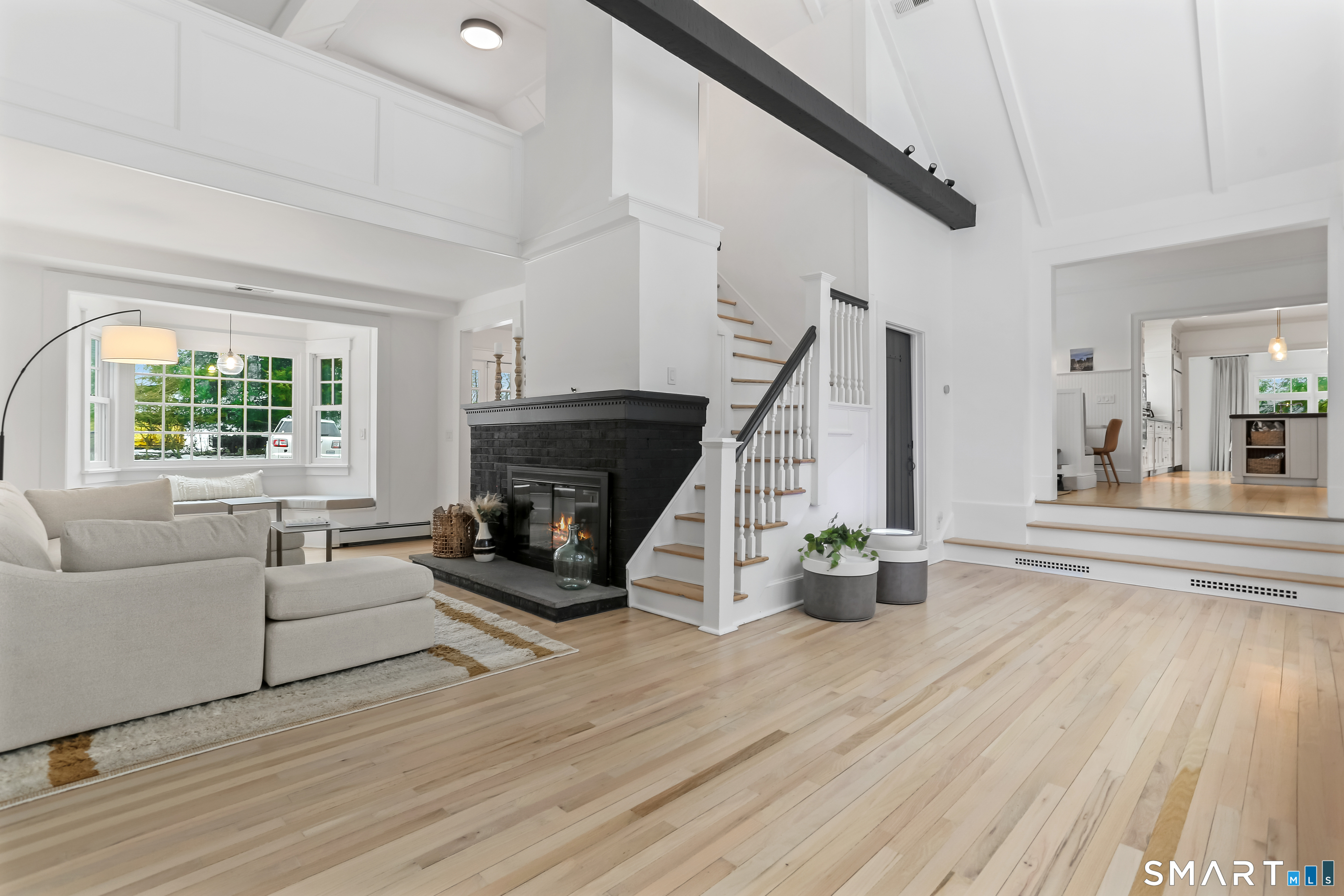 3 Riverview Road Westport, CT 06880 - Photo 2 of 29 a living room with furniture and a fireplace