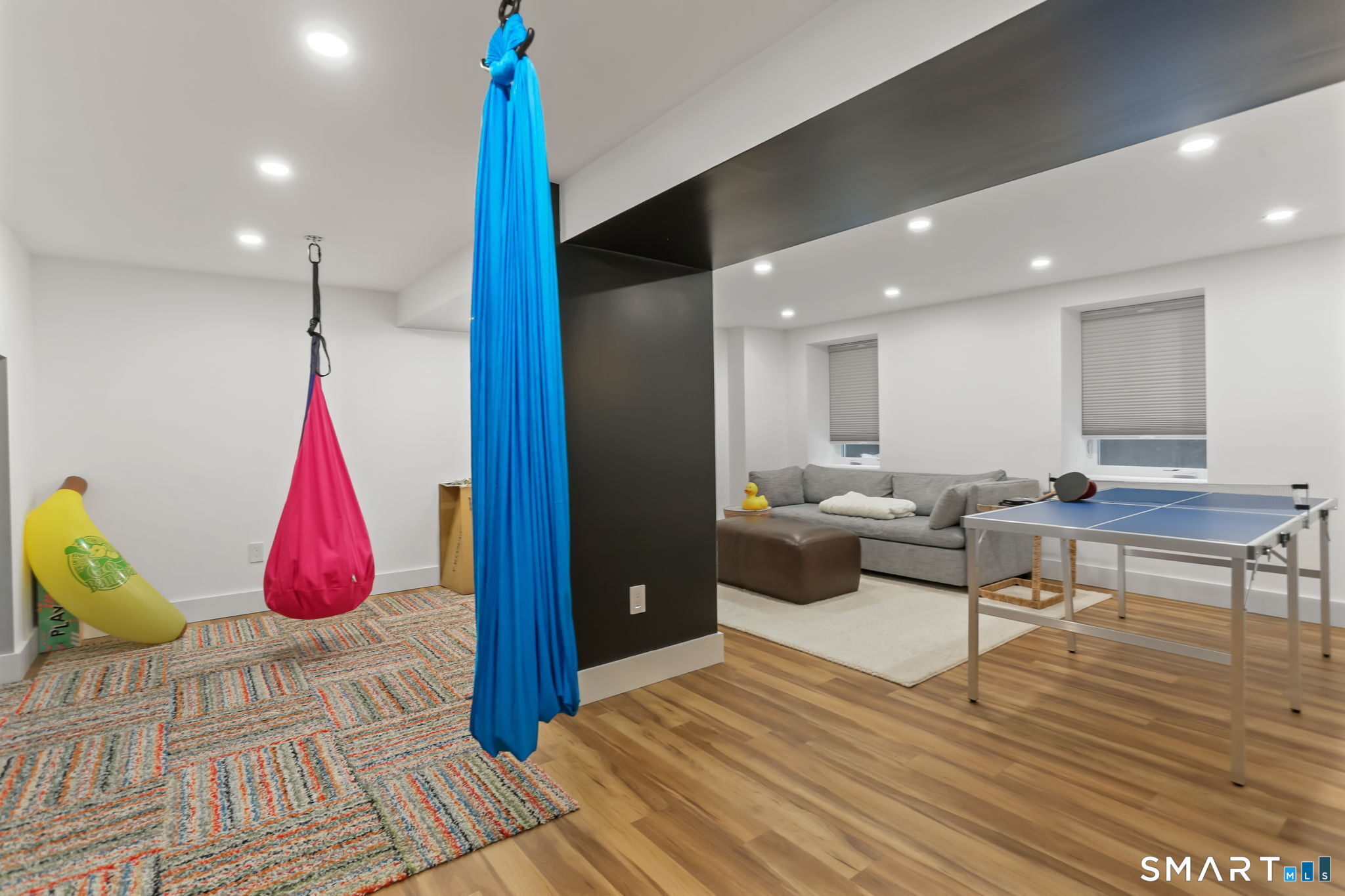 3 Riverview Road Westport, CT 06880 - Photo 23 of 29 a living room with furniture a rug and white walls