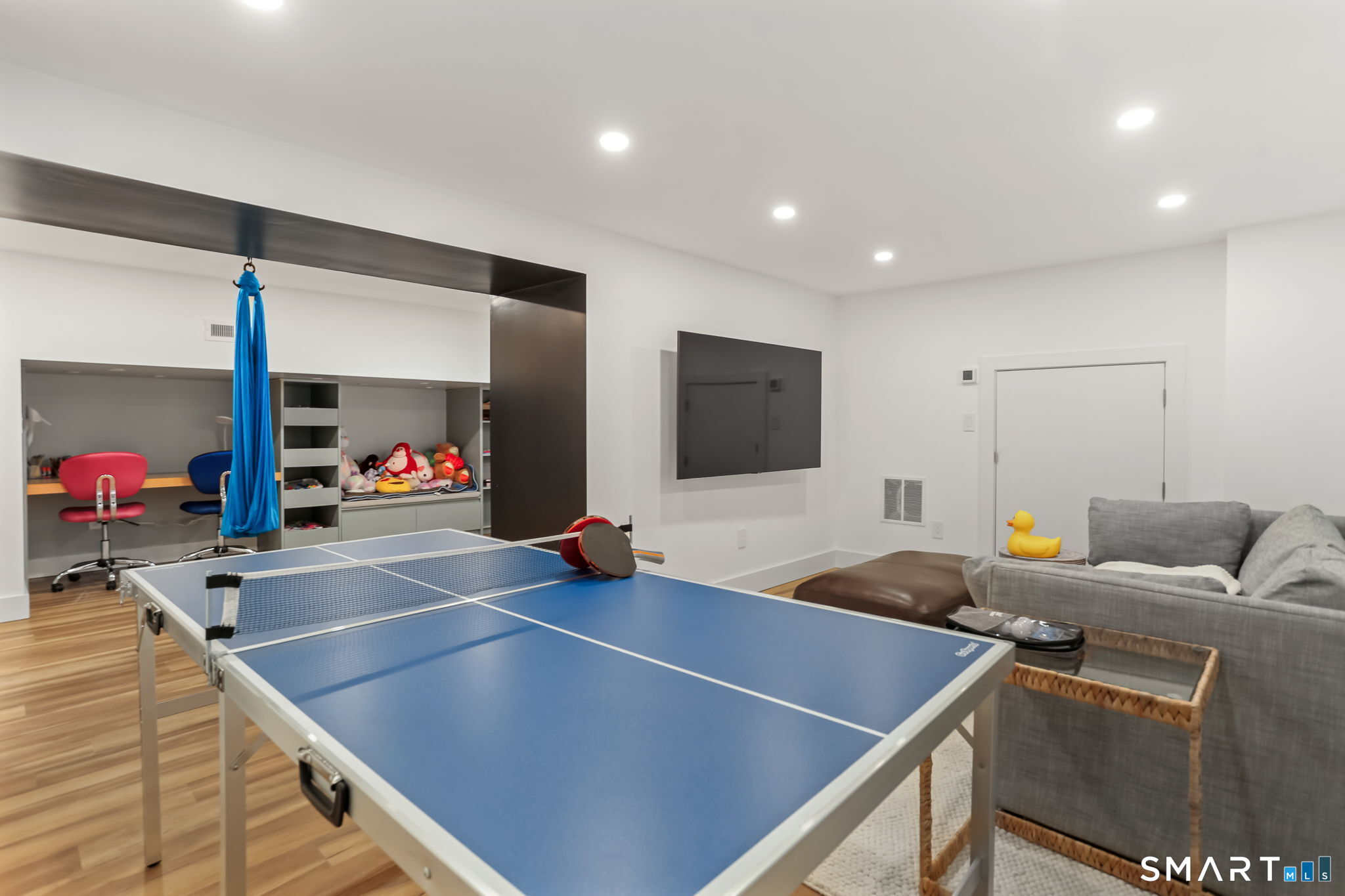 3 Riverview Road Westport, CT 06880 - Photo 24 of 29 a room with furniture and a flat screen tv