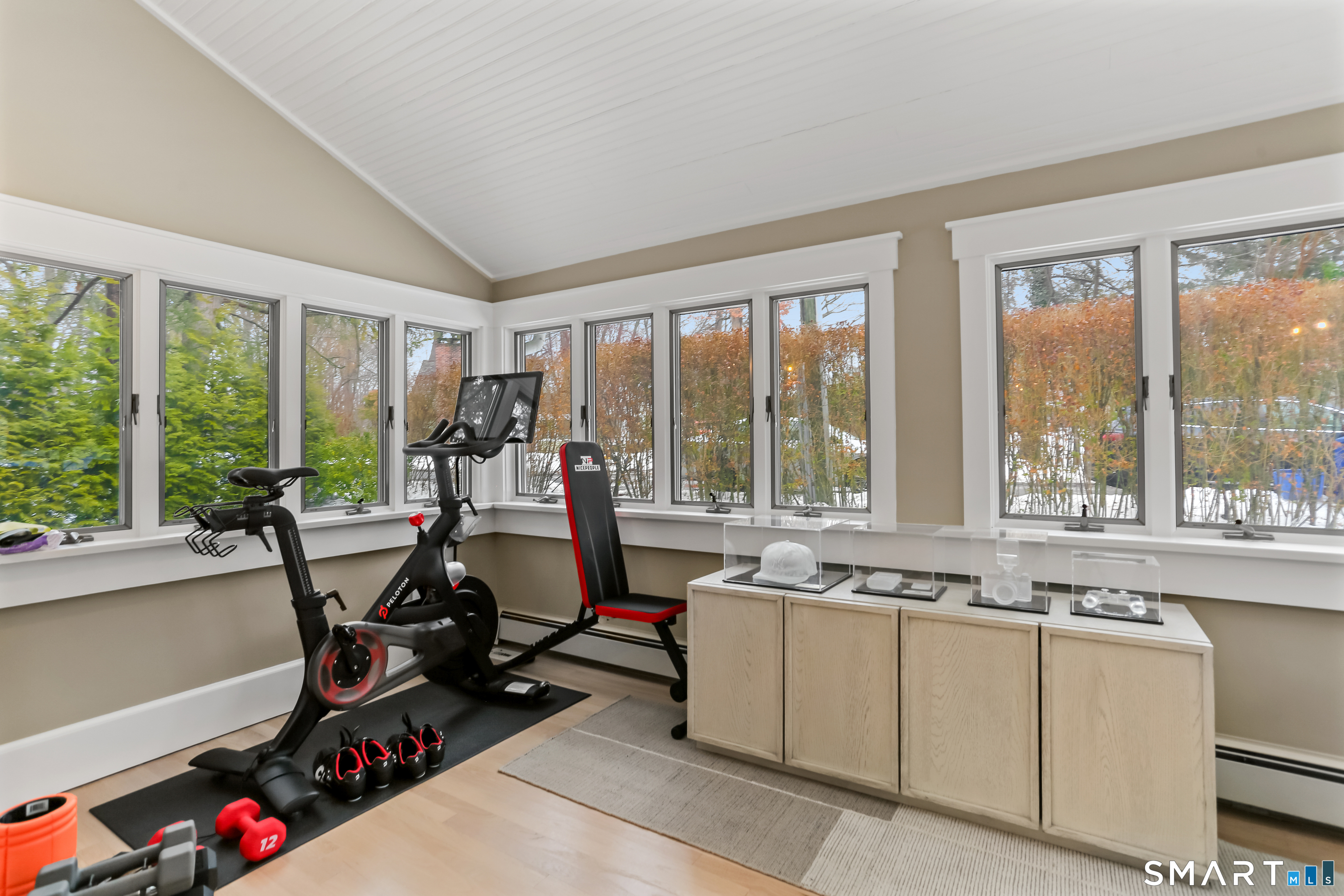 3 Riverview Road Westport, CT 06880 - Photo 3 of 29 a view of a room with gym equipment and a large window