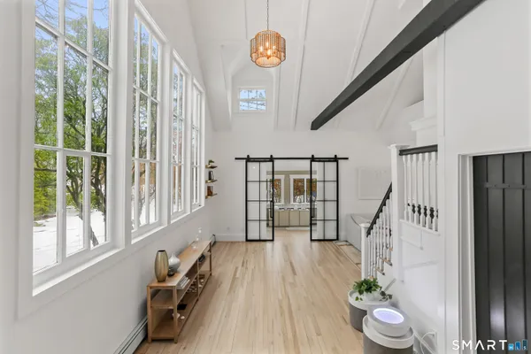 a view of entryway with wooden floor