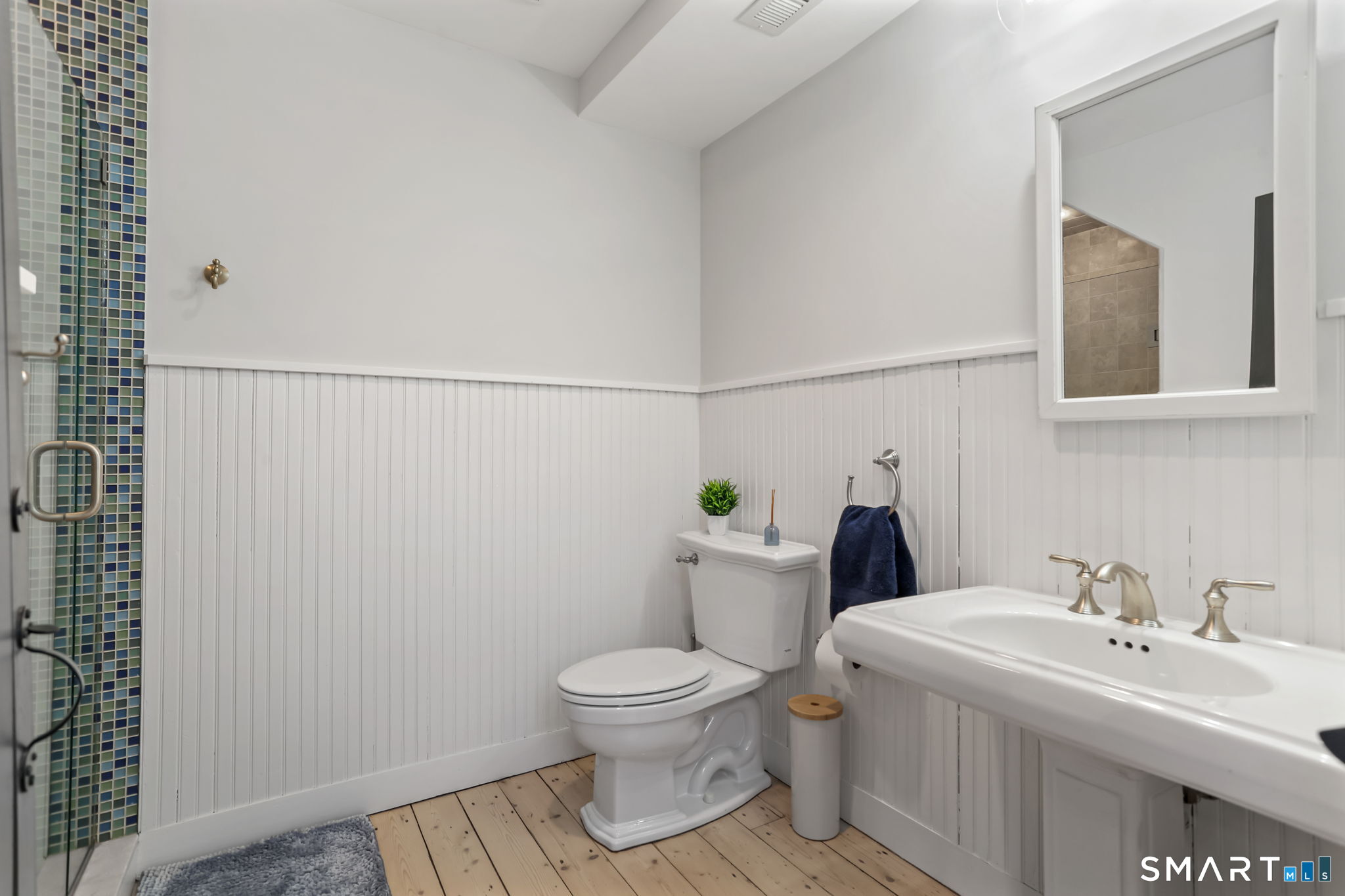 3 Riverview Road Westport, CT 06880 - Photo 7 of 29 a bathroom with a toilet sink and mirror