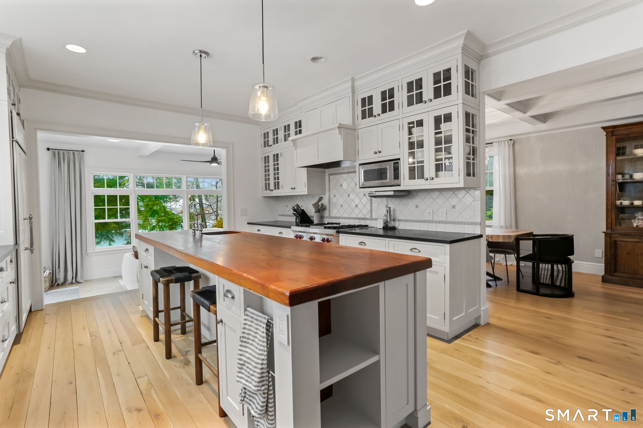 3 Riverview Road Westport, CT 06880 - Photo 8 of 29 a kitchen with stainless steel appliances granite countertop a sink a stove and a wooden floors